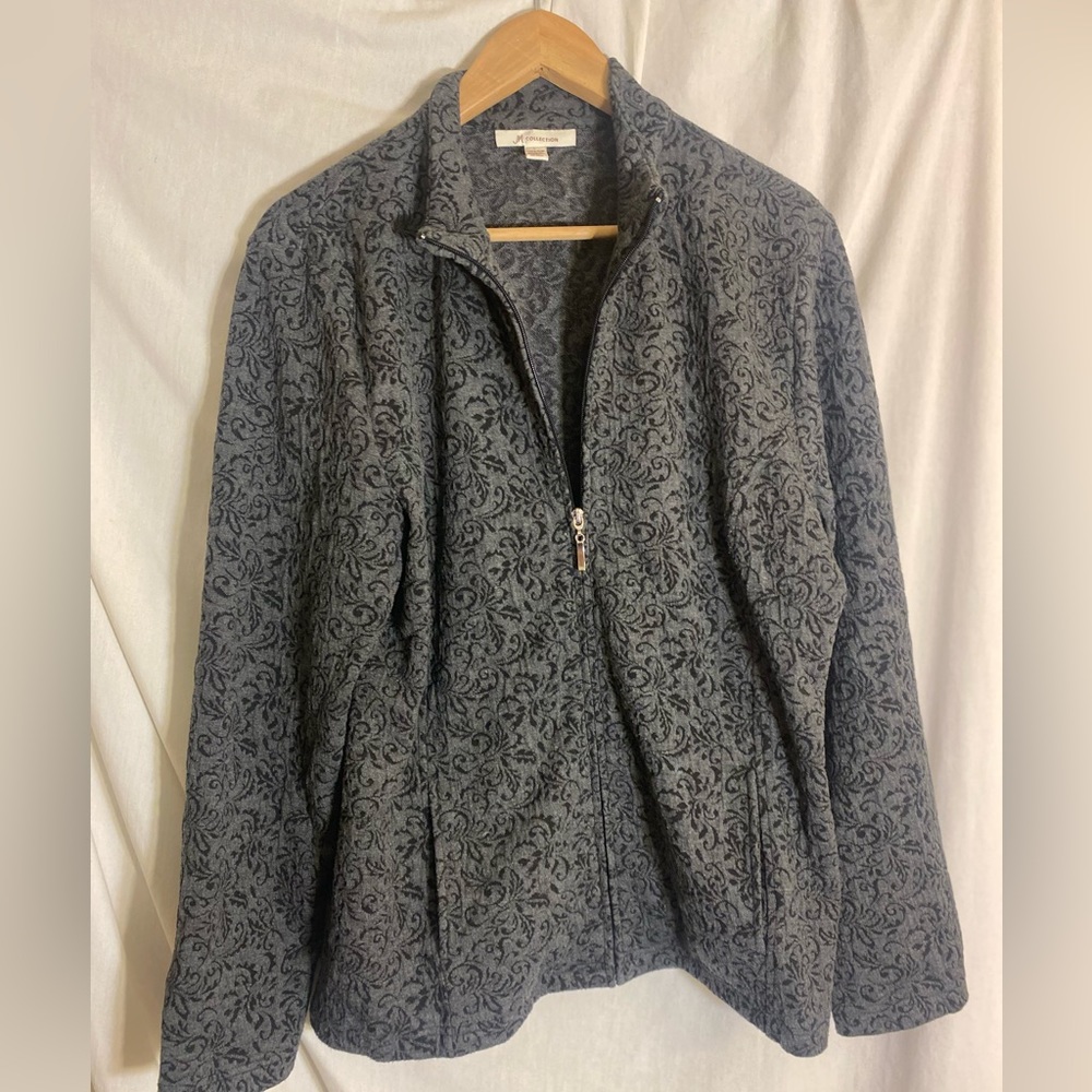 Woman’s zip up coat size L.